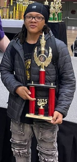 Student holding a trophy